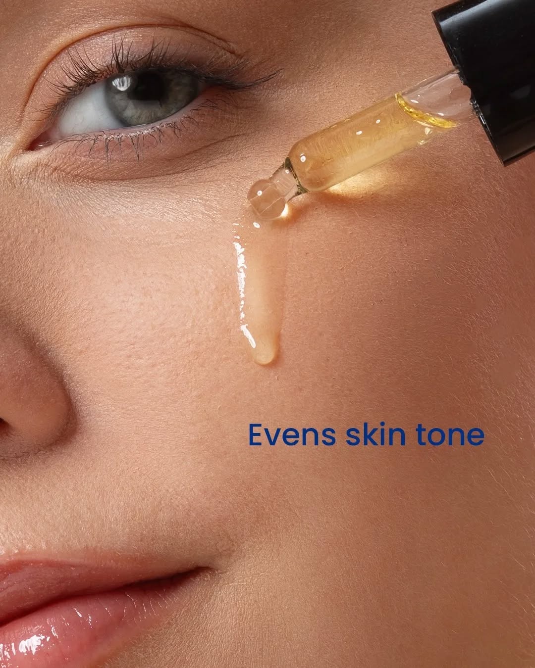 Close-up of a dropper applying a liquid to a person&
